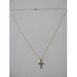 A 9ct gold diamond crucifix, 21mm long, 0.15ct, on a fine 9ct 46cm chain, total approx 1.2 grams