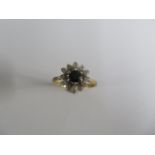 An 18ct yellow gold sapphire and diamond cluster ring, size O, approx 4.6 grams, in good condition