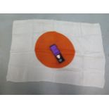 A silk Japanese flag and a boxed medal