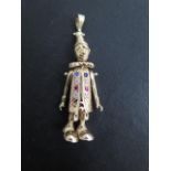 A 9ct hallmarked yellow gold articulated clown multi jewel pendant, 5.5cm long, approx 14.5 grams in