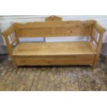 A Continental stripped pine hall bench with a lift up seat with storage, 106cm tall x 183cm x 48cm
