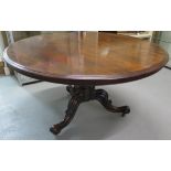 A 19th century rosewood tilt top breakfast table of circular form on central bulbous stem and