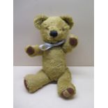 A vintage Merrythought teddy bear, 33cm tall