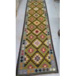 A hand knotted woollen Maimana Kilim runner, 293cm x 78cm