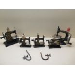 Five vintage miniature hand crank sewing machines, from 13cm to 17cm tall
