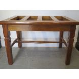 A hardwood luggage stand, 43cm tall x 63cm x 42cm, in good condition