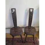 A pair of carved spinning chairs, 87cm tall