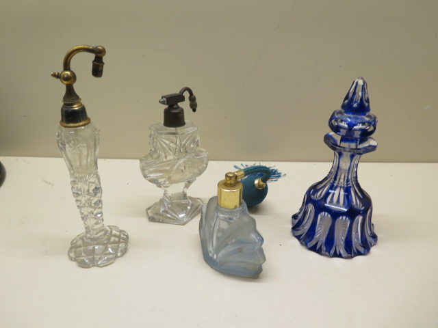 A collection of perfume bottles, blue bottle stopper stuck, chips to base others reasonably good