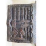 A Dogan Mali carved granary door with figures and birds, overall 64cm x 42cm