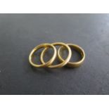 3 x 22ct hallmarked yellow gold band rings, sizes M/N and R, total weight approx 14.4 grams