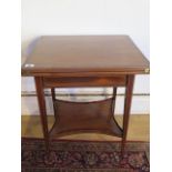 An Edwardian mahogany fold over tea table by Edwards and Roberts, top needs re-attaching