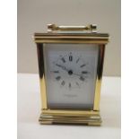 A Taylor and Bligh brass 8 day carriage clock striking on a bell, 15cm tall, brought in 1985 for £