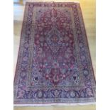 A hand knotted woollen Aaran rug, 2.10m x 1.25m, in good condition