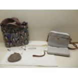 A Fossil polka dot bag and purse and a bird decorated Fossil bag and a Fossil purse with 2 dust