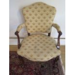 An 18th century and later mahogany upholstered elbow chair with horse hair filling, some old repairs