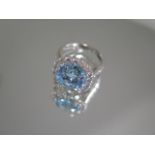 A hallmarked 18ct white gold blue topaz and diamond ring, approx 1.5ct of diamonds, size M, head