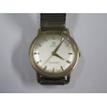 An Omega automatic Seamaster Presentation 9ct gold gents wristwatch, 33mm case, on a chrome strap,