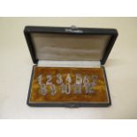 A set of 12 peg / table markers, 15mm tall, boxed