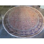 A hand knotted woollen Tabriz rug, 2.30cm diameter, generally good small patches of wear .