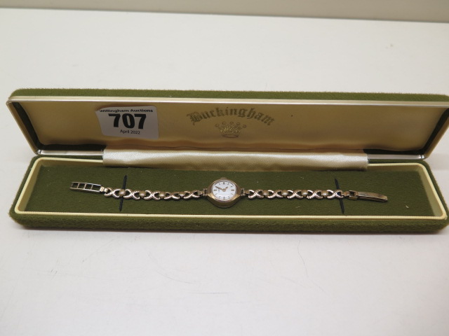 A manual wind 9ct ladies wristwatch on plated strap, running, 15mm case, approx total weight 10