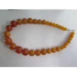 A butterscotch similar type bead necklace, 52cm long, largest bead approx 2cm x 2.5cm, approx 118