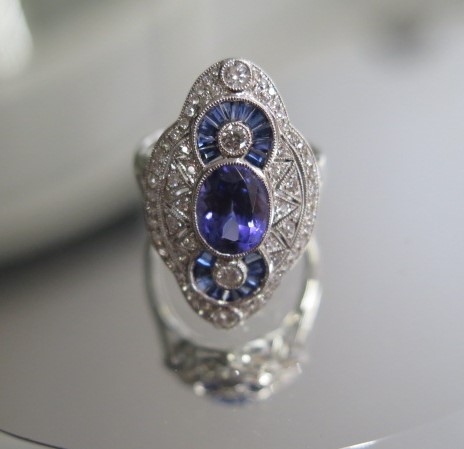 A good 750 white gold Art Deco style tanzanite, sapphire and diamond ring, tanzanite approx 1.9ct,