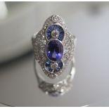 A good 750 white gold Art Deco style tanzanite, sapphire and diamond ring, tanzanite approx 1.9ct,
