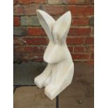 A hand carved stylised rabbit sculpture made from Clipsham limestone by a Cambridgeshire based stone