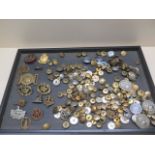 A collection of assorted military and other badges and buttons