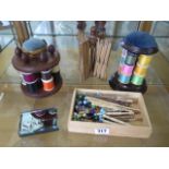 Two bobbin reel holders, assorted bobbins, a winder and sirdar wools paperweight