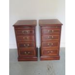 A pair of new hardwood four drawer bedside chests each with a slide, made by a local craftsman to
