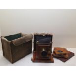 A mahogany and brass bellows plate camera with a Ross 8 x 5 lens, cloth case marked The