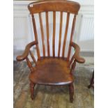 A 19th century elm and beech broad arm and splat back armchair, in polished condition