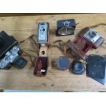 A vintage camera, plates, meters, developing time clock etc