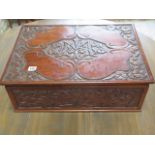 A carved mahogany box with a tray interior, 19cm tall x 54cm x 38cm