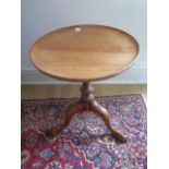 A Georgian style elm tripod side table with a 43cm diameter top, 54cm tall