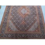 A hand knotted woollen fine Tabriz rug, 2.08cm x 1.48cm, generally good