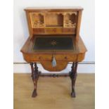 A good Victorian burr walnut inlaid bonheur de jour worktable with a fall front enclosing a fitted