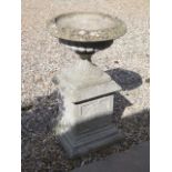 A stone effect garden urn on stand, 90cm tall x 51cm diameter (comes in three parts)