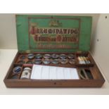 A Winsor and Newton mahogany paint box with contents, 38cm wide