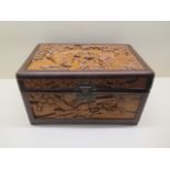 A Chinese Republic period wooden box and lock with carved panels of figures in a landscape