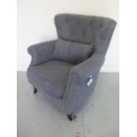 A Wayfair button back armchair with a cushion in unused condition, 90cm tall x 76cm wide