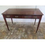 A circa 1900's mahogany Heals and Son side table with 2 frieze drawers tapering legs, caps and