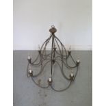 A shabby chic 8 branch metal work electric ceiling lamp, 78cm tall x 87cm wide