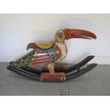 A decorative bird child's rocker, 65cm tall x 105cm