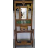 An oak mirror and tile back hallstand with glove drawer, 192cm tall x 80cm