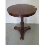 A good 19th century rosewood tilt top sidetable on an octagonal column and tripartite platform base,