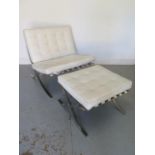 A Barcelona style chair with footstool in white leather, good condition, some signs of wear
