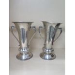 A near pair of silver Golfing trophies, hallmarked London 1935/36 CB, and London 1928/29, both