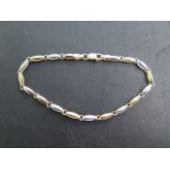 A 9ct hallmarked yellow and white gold bracelet, 19cm long, approx 3.8 grams, catch good